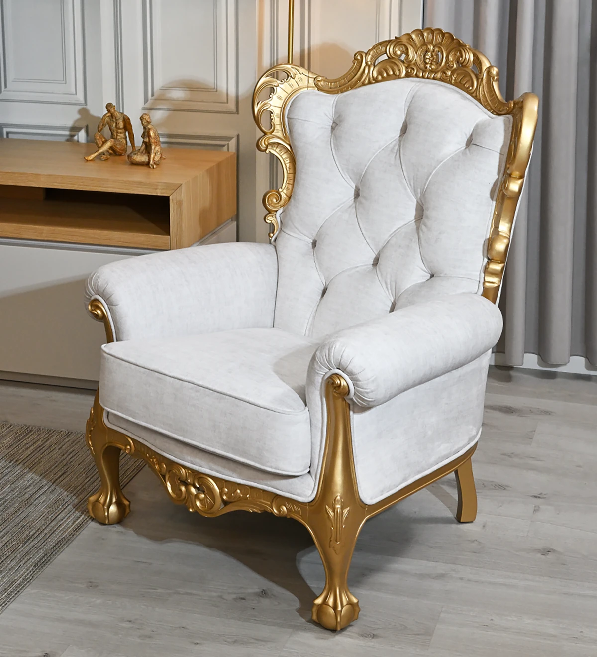 Armchair upholstered in fabric, golden lacquered structure.