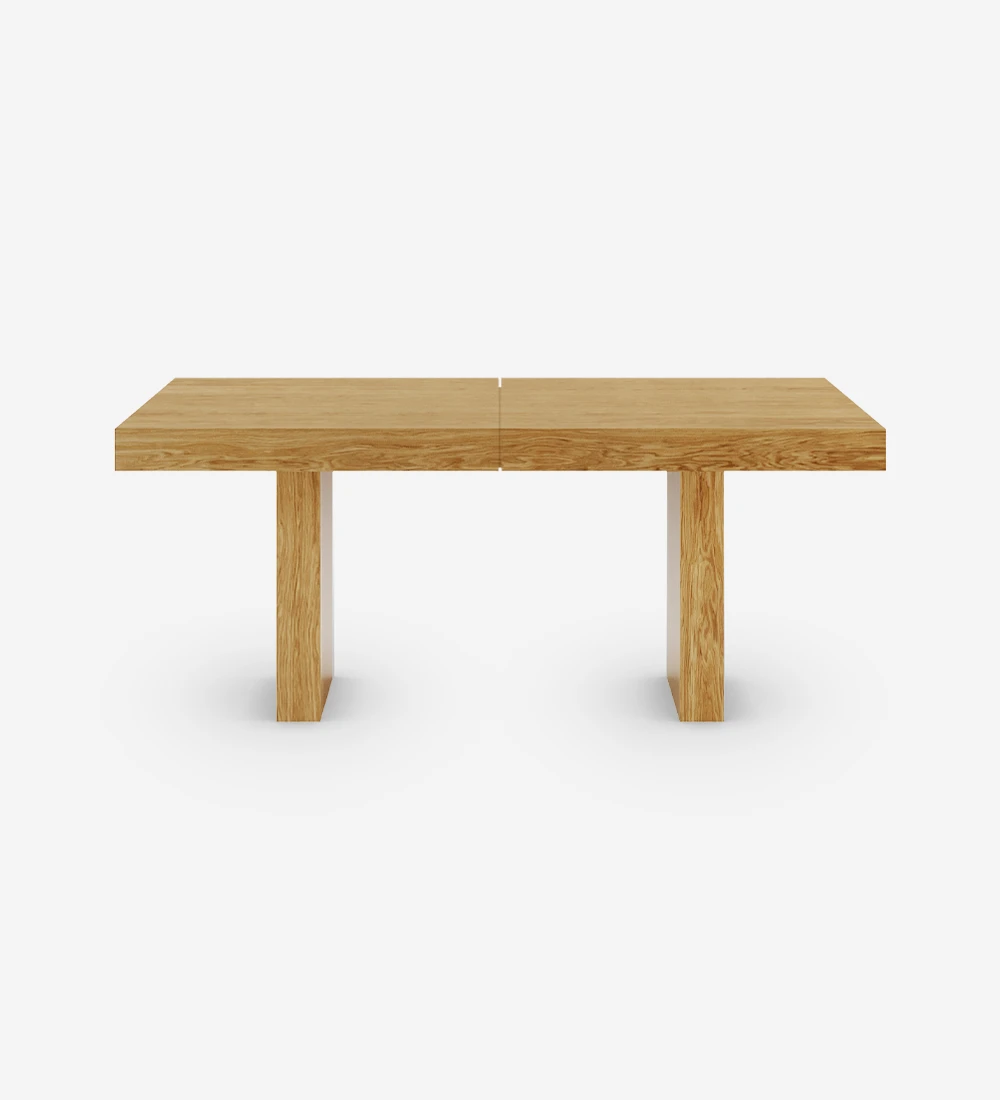 Rectangular extendable dining table in natural oak.