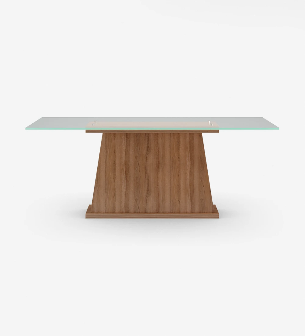 Rectangular dining table with glass top, center foot and walnut base.