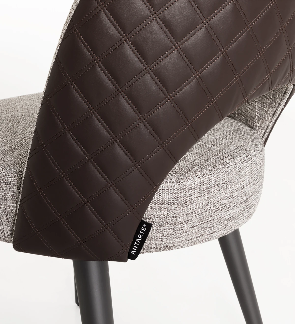 Chair upholstered in fabric, black lacquered feet.