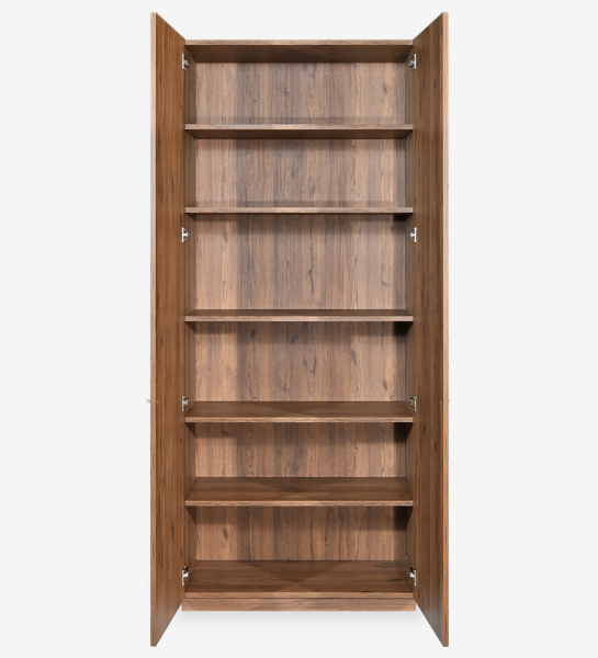 Tall bookcase in aged oak, with 2 doors and removable shelves.