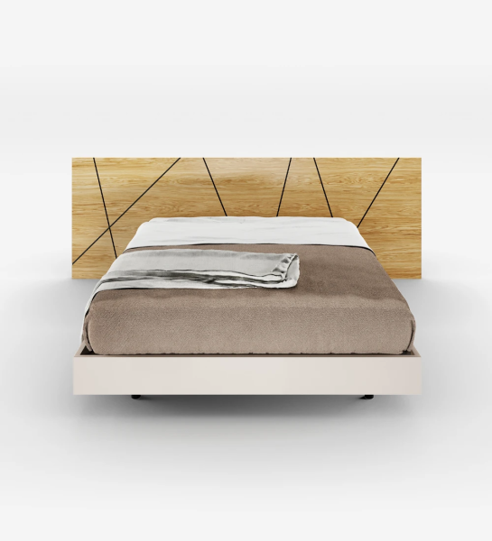 Double bed with abstract headboard in natural oak and suspended base in pearl.