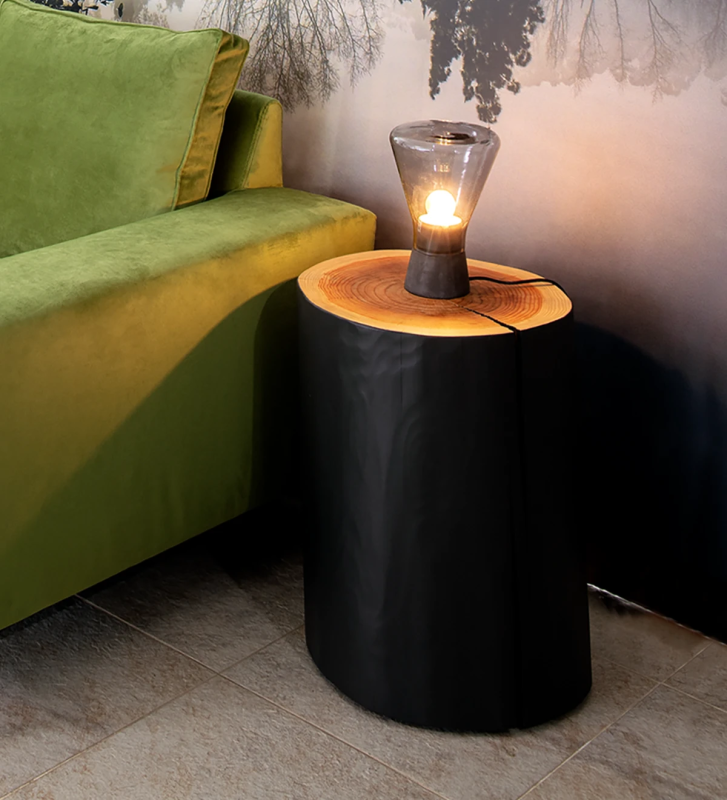 Trunk side table in natural cryptomeria wood, lacquered in black.