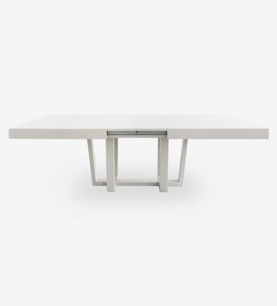 Rectangular extendable dining table with pearl lacquered top and legs.