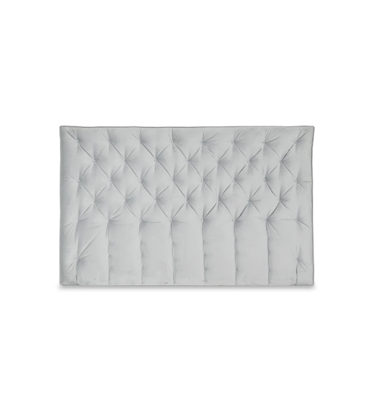 Headboard upholstered in fabric.