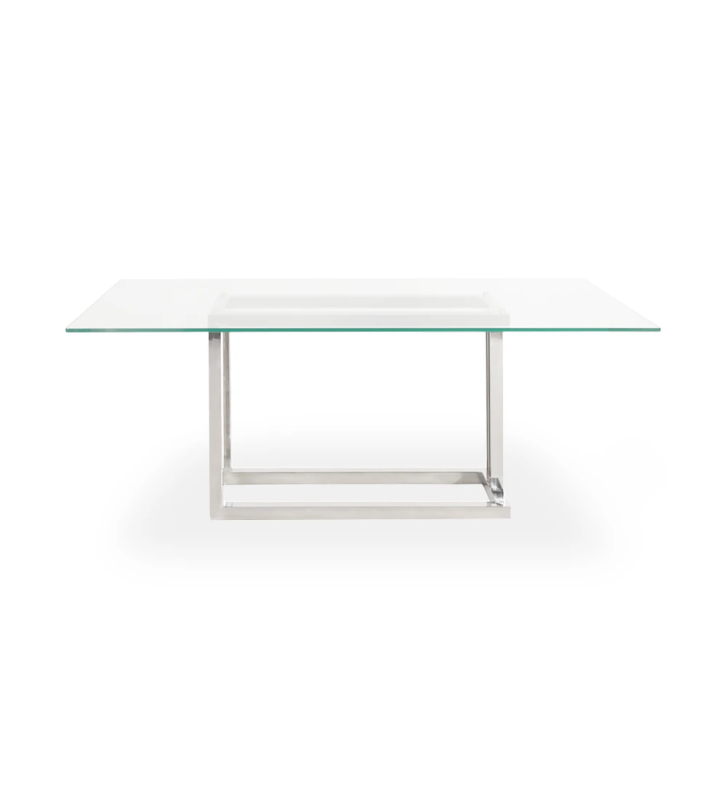Mesa de comedor rectangular con tablero de cristal y pie de acero inoxidable.