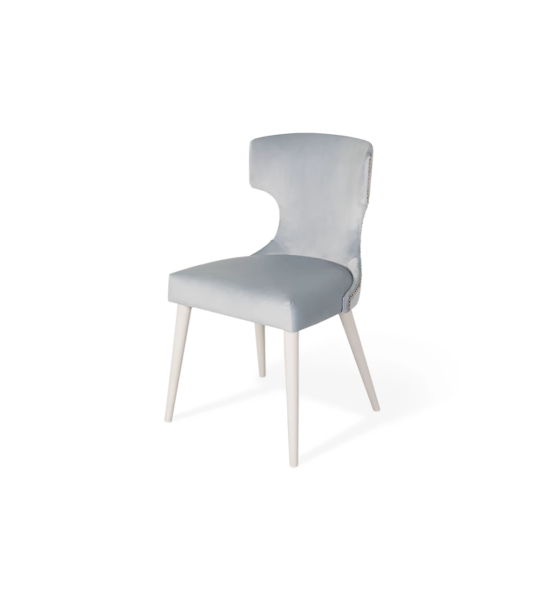 Fabric upholstered chair, with silver tack on the back and pearl lacquered feet.