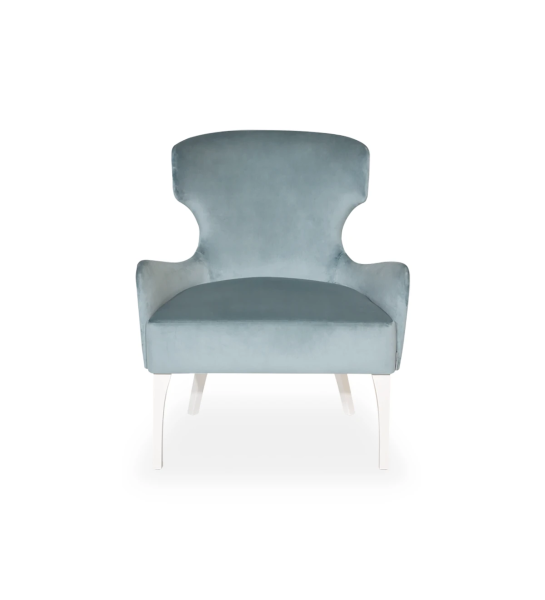 Fauteuil Pico recouvert en tissu saphir, clous argentés, pieds laqués perle.