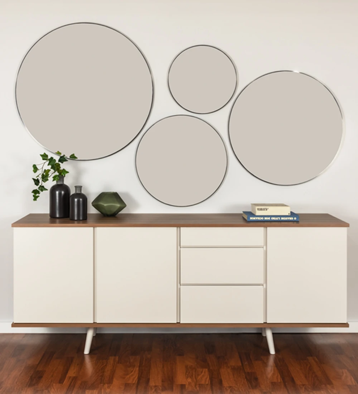 Round mirror with dark brown lacquered structure.